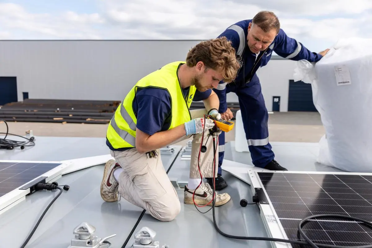 Wattlab team installing Solar Flatrack panels on a vessel deck