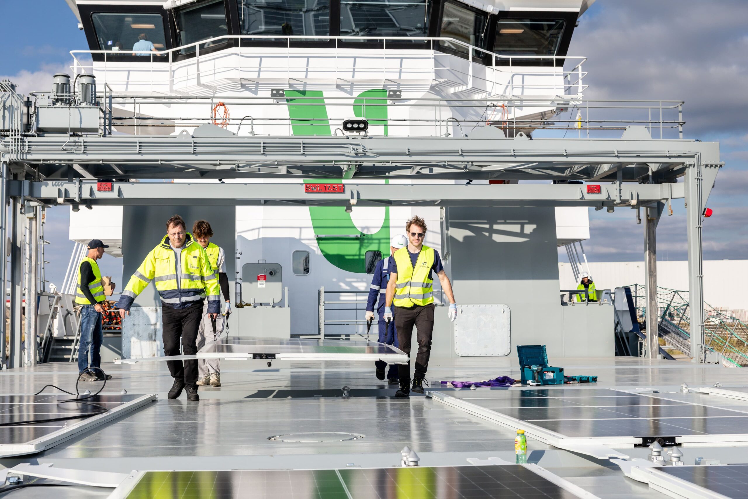 Wattlab team installing solar panels on the deck of a vessel
