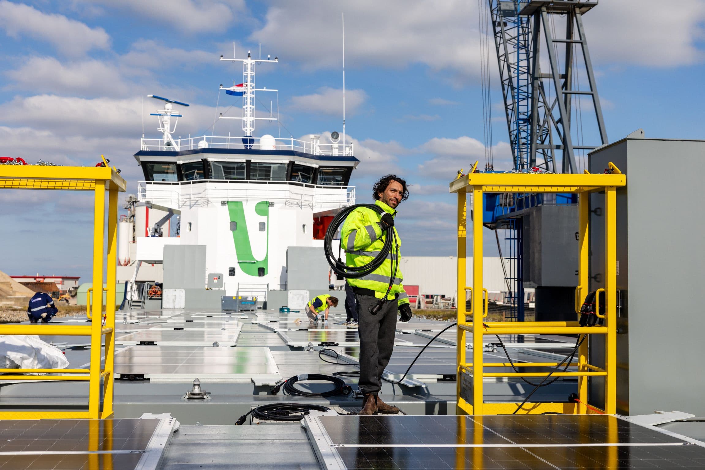 Wattlab engineer installing electrical systems on vessel deck